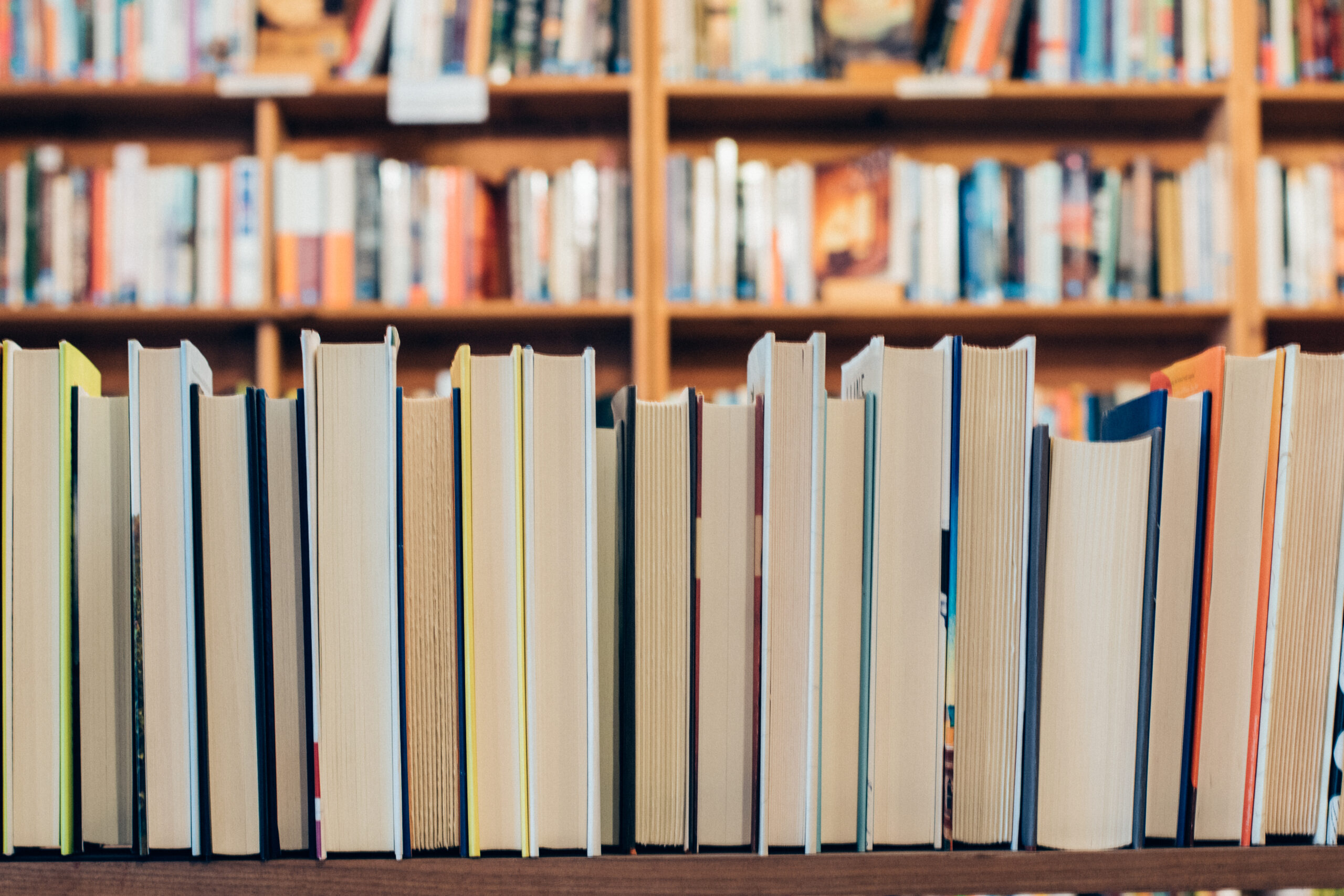 a row of books with the pages facing the viewer